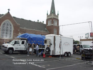 Downtown los Angeles trailer parked next to a church