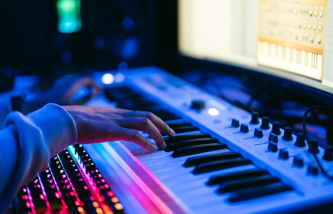 Closeup of hands on a musical keyboard. Live audio streaming.