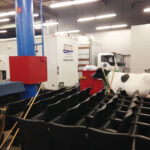 cow, theatre seats, mobile studio in a warehouse, Pepsi Super Bowl Halftime Show